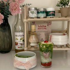 the shelf is filled with various items for making soaps and body washes on it