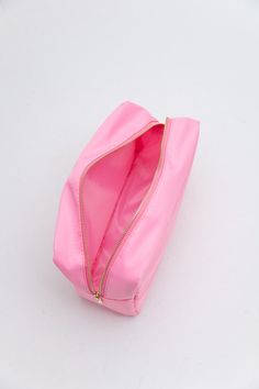 This large pouch is an absolute must have for staying organized. Featuring large inner holds. It's helpful for packing and travel to store makeup, hair tools and accessories, first aid, meds, or more. Dimension length: 11". Height: 7.5". Depth: 4.25. Soft nylon material. Gold-tone hardware. Zip closure. Large Pouch, Makeup Pouch, Travel Makeup, Makeup Hair, First Aid, Staying Organized, Hair Tools, Gold Tones, Pouch