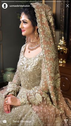 a woman in a wedding dress sitting down