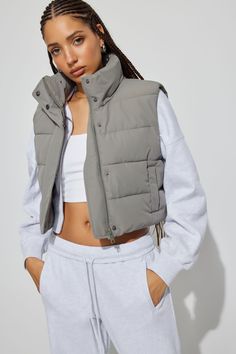 Just chill. Exude main character energy with this puffer vest. Features - Quilted - Front zip closure with button placket - Two welt pockets with snap closure - Lined - Inner patch pocket Size & Fit - Fit: Fitted - Length: Cropped - The model is wearing size S Materials & Care - Content: 100% Recycled Polyester - Care: Dry clean only - Imported Main Character Energy, Just Chill, Main Character, Puffer Vest, Pocket Size, Button Placket, Welt Pockets, Welt Pocket, Snap Closure