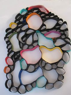 a bunch of glasses that are sitting on a white surface, some have been made out of them