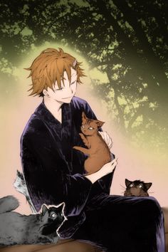 a man sitting on the ground holding two cats