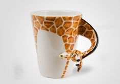 a giraffe print coffee cup on a white background