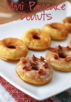 six donuts with bacon on them sitting on a white plate