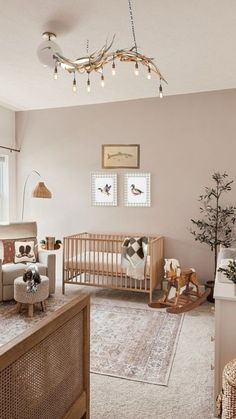 a baby's room is decorated in neutrals and whites, with an animal themed crib