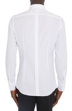 Channel a trim, tailored aesthetic in this cotton button-up shirt that features a crisp point collar and long sleeves. 30 1/2" length (size 40) Front button closure Point collar Long sleeves with button cuffs 100% cotton Dry clean or machine wash, line dry Made in Italy Men's Designer Clothing Business Casual Slim Fit Dress Shirt With Collar, Slim Fit Dress Shirt For Business Casual, Fitted Long Sleeve Dress Shirt With Buttons, Designer Business Button-up Shirt, White Long Sleeve Dress Shirt With Concealed Placket, Designer White Shirt With Concealed Placket, Designer Business Shirt With Spread Collar, Designer Business Shirt With Fold Down Collar, Business Dress Shirt With Concealed Placket