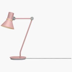 a pink desk lamp on a white background