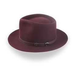 Description Materials Craftsmanship Hat Care Shipping Returns Product Description A Burgundy Western Fedora in Outback Style Step into adventure with the Compass, a burgundy Western fedora handcrafted from luxurious rabbit fur felt. Featuring a distinctive teardrop crown and a broad 3" brim, this hat provides both sun protection and unmatched style. Custom-made to fit your exact head size, the Compass allows for personalization with a choice of hatbands, including a stylish leather belt. Deliver Homburg, The Compass, Hat Box, Formal Casual, Head Shapes, And So The Adventure Begins, Rabbit Fur, Cotton Bag, Green Fashion