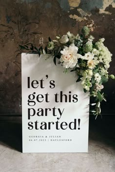 a sign that says let's get this party started with flowers on it and the words, let's get this party started