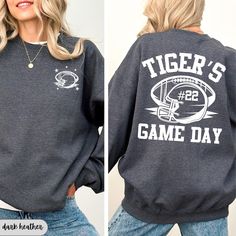 Here at Daisy May we sell the cutest Tigers Gameday Football sweatshirts! Our Sports Fan hoodies are made with the highest quality materials and every design is handmade to order using an eco friendly ink!  ♥How to order♥ *Please look through all product photos and double check your size with our size charts! *Choose the size, color and garment that you want!  *Add to cart! *Select your shipping option *Check out ♥Important info♥ *We do not accept returns or exchanges. If you are unsure if the g Game Day Long Sleeve Hoodie With Graphic Print, Custom Print Long Sleeve Sports Sweatshirt, Game Day Hoodie With Sports Season Theme, Game Day Screen Print Sweatshirt For Fall, Game Day Fleece Hoodie With Crew Neck, Custom Print Long Sleeve Sweatshirt For Sports, Game Day Fleece Sweatshirt With Graphic Print, Fall Team Spirit Sweatshirt With Screen Print, Game Day Long Sleeve Pre-shrunk Hoodie