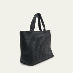 Saint Laurent tote bag in woven raffia and viscose Features tonal raised logo lettering on the front Two top handles; 17.4" drop Open top Interior, one leather slip pocket Approx. 16.9"H x 19.6"W x 6.6"D Professional cleaning recommended Imported Luxury Straw Bag With Rolled Handles For Daily Use, Modern Woven Leather Bag For Vacation, Luxury Straw Bag With Large Capacity And Double Handle, Luxury Large Capacity Straw Bag With Double Handles, Modern Vacation Bags With Top Carry Handle, Modern Vacation Bag With Top Carry Handle, Black Straw Bag With Rolled Handles, Black Bags With Rolled Handles For Vacation, Black Vacation Bags With Rolled Handles