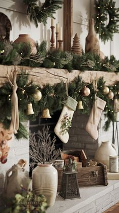 a fireplace decorated with christmas stockings and ornaments