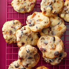 chocolate chip cookies are cooling on a pink wire rack, ready to be eaten for breakfast