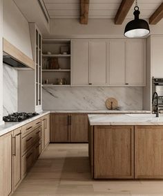 a kitchen with marble counter tops and wooden cabinets