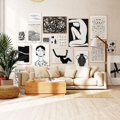 a living room filled with lots of art on the wall above a couch and coffee table