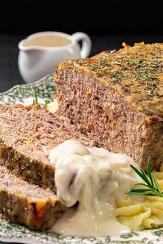 meatloaf with cream sauce and pasta on a plate