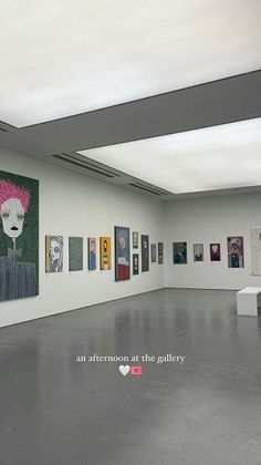 an art gallery with paintings on the walls