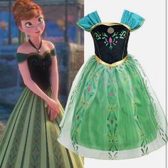 the dress is green and has a black top with blue trimmings on it