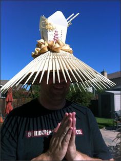 a man wearing a hat made out of sticks