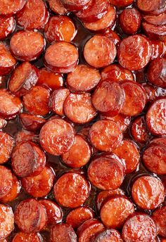 close up view of cooked sausages in brown sauce