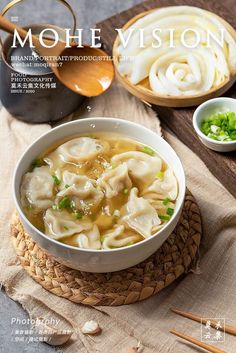 a bowl of soup with chopsticks on the side