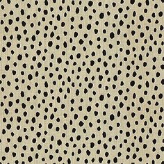 an animal print fabric with black spots