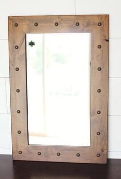 a wooden frame with rivets on it