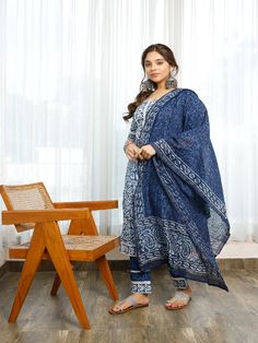 Affordably stylish every day clothing. This handmade indigo bagru print A cotton a-line kurti with gota detailing is tastefully decorated with flower designs. includes a lace-trimmed pant and a chanderi indigo-printed dupatta with paisley borders on the ends. You must have ethnic clothing in your collection this season. Neck: Round Neck Sleeve Length: 3/4th Sleeves Kurta Length: Calf Length Fabric: Kurta & Bottom - Cotton Dupatta - Chanderi Note: Wash Care Instructions - Dry Clean Only. The prod Indigo Printed Straight Kurta Set, Bohemian Indigo Straight Kurta Set, Blue Block Print Mulmul Kurta, Indigo Block Print Sets For Diwali, Blue Mulmul Salwar Kameez With Kalamkari Print, Festive Indigo Sets With Block Print, Festive Indigo Block Print Set, Traditional Indigo Kurta With Printed Motifs, Bohemian Blue Cotton Anarkali Set