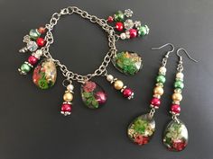 Elegant & Stylish Dangling Drop Hook Earrings and Floral Charm Bracelet Jewelry Set with Pearls, Glass Crystal Beads and Resin Tear Drop Pendants  Great for any occasion. Unique Design   Main Colors:  Cherry Red, Shamrock Green, Pale Yellow and White Earring Length: 3 1/2 inches long Both Earrings weigh: 0.3 oz Bracelet Length: 8 1/2 inches  Weight of Bracelet 1.2 oz Please review the photos carefully for they are part of the description. Thank you.