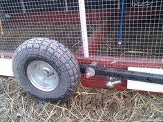 a wheel attached to the side of a fence