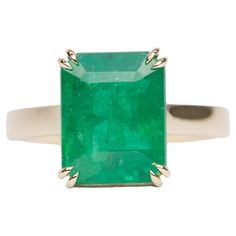 ♥ A solid 14K yellow gold ring set with a stunning emerald in the center with double claw prongs ♥ Gorgeous green color! ♥ The item measures 12.1mm in length, 9.9mm in width, and stands 7.8mm from the finger ♥ US Size 7 (Free resizing up or down 1 size) ♥ Band width: 2.8mm ♥ Gemstone: Emerald, 5.33ct ♥ All stone(s) used are genuine, earth-mined, and guaranteed conflict free! As is with anything that is naturally occurring, our gemstones or pearls will have imperfections, e.g. inclusions in the g Emerald Statement Ring, Ring Rosegold, Yellow Gold Solitaire, Claw Prong, Right Hand Rings, Zambian Emerald, Gold Ring Sets, Yellow Gold Ring, Jewelry Rings Engagement