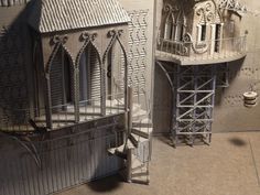 an architectural model of a building with scaffolding