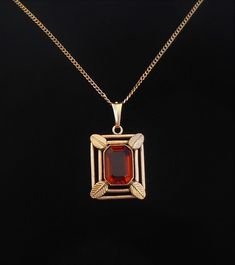 A beautiful vintage gold plated pendant with light brown paste glass. Dimensions:  Length: 62cm  / 24.4 inches. Diameter of the pendant: 2.4 X 2 cm / 0.94 X 0.78 inches ( excl. the loop). Weight: 8.4 grams.  Marked: Am. Double. Good condition, the paste glass has a few minimal chips. Standard free (uninsured) registered shipping is sent with the postal services.  Please pay attention to the fact that I'm offering old, used sometimes antique objects meaning that they all are expected to have time Antique Gold Necklace With Rectangular Pendant, Formal Necklace With Rectangular Locket Pendant, Vintage Formal Necklace With Rectangular Pendant, Art Deco Locket Necklace For Formal Occasions, Formal Art Deco Locket Necklace, Antique Rectangular Pendant Necklace For Formal Occasions, Vintage Yellow Gold Necklace With Rectangular Pendant, Antique Gold Plated Necklace For Formal Occasions, Art Deco Yellow Gold Locket Necklace