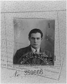 a black and white photo of a man in a suit on a stamp with words written below it