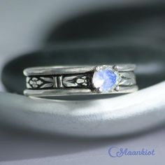 These Rainbow Moonstone Couple Promise Rings make a striking pairing! The cabochon ring features a 4 mm stone securely set in a fine silver bezel. The faceted stone ring features a 5 mm faceted stone set in a filigree prong mounting. We are happy to create this beautiful set for you in a variety of gemstone choices, size options, and finishes.For the Wide Ring:This ring features a 4 mm cabochon set on a Sterling Silver band. The band measures 6 mm wide (about .25"). The Art Deco inspired design Silver Stackable Jewelry With Round Stones, Silver Stackable Moonstone Ring For Anniversary, Stackable Silver Moonstone Ring For Anniversary, Sterling Silver Cabochon Moonstone Ring, Moonstone Cabochon Jewelry For Anniversary, Sterling Silver Moonstone Ring With Stone Setting, Sterling Silver Moonstone Ring With Round Stone Setting, Sterling Silver Moonstone Ring With Round Stone, Jewelry With Bezel Setting And Round Stone For Promise