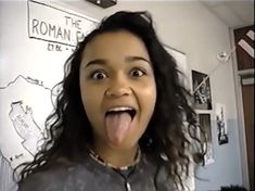 a woman making a funny face while sticking her tongue out