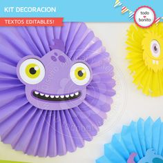 three different colored paper fans with eyes and mouths on the top one is yellow, purple, and blue