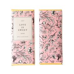 two pink and yellow boxes with floral designs on the front, one has a white label that reads love is sweet