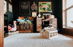 a room with black walls and white carpet