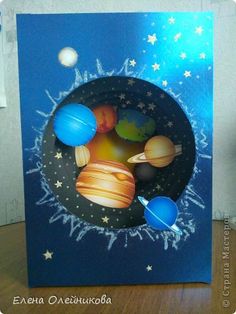 a card with an image of the solar system on it and stars in the sky