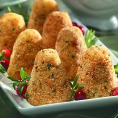 small appetizers are arranged on a white plate