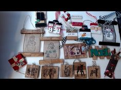 various christmas cards and ornaments are laid out on a table