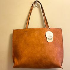 Nwt. Camel Outside, Taupe Inside. Comes With Pochette, Wallet, Shoulder Bag. Dust Bag Included. 18.5” L 13.5” W Casual Dark Tan Bag For Everyday Use, Casual Dark Tan Bag, Brown Reversible Travel Bag, Reversible Brown Shoulder Bag With Double Handle, Brown Reversible Bags For On-the-go, Brown Reversible Shopping Bags, Brown Reversible Shoulder Bag For On-the-go, Reversible Brown Shoulder Bag For On-the-go, Reversible Brown Shoulder Bag For Travel