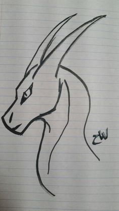 a drawing of a dragon on lined paper