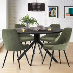 a dining room table with four chairs around it