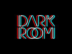 the words dark room are lit up in red, blue and green neon letters on a black background