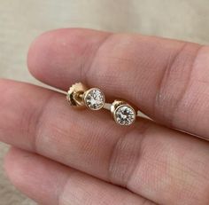 ◈ Handmade in the U.S.A. ◈ Diamond: 100% Natural Diamond ◈ Secure screw-back locks to ensure easy, comfortable, and safe wear. ◈ Diamond Weight: Approx. One Piece total: 0.10 ct. (3mm) One Pair total: 0.2ct (0.10 ct.(3mm) x2) ◈ Color: F ◈ Clarity: SI ◈ Cut: Brilliant Cut ◈ Metal: Solid 14K Gold (18K also available - Additional fees may apply) ◈ Gold Color: White gold, Rose gold, Yellow gold ✦ Comes in a beautiful package ready for gift-giving♥ Processing Times - The current processing time is 10 Tiny Diamond Earrings, Square Diamond Engagement Ring, Triangle Diamond Ring, Real Diamond Earrings, Gold Bar Earrings, Gold Diamond Earrings Studs, One Earring, Gold Diamond Studs, Unique Diamond Engagement Rings