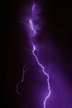 a black and white photo of lightning in the sky