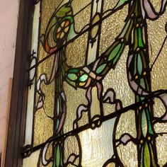 a stained glass window with flowers on it