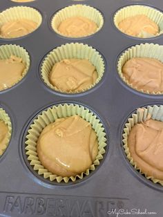 cupcakes with peanut butter frosting in a muffin tin ready to go into the oven